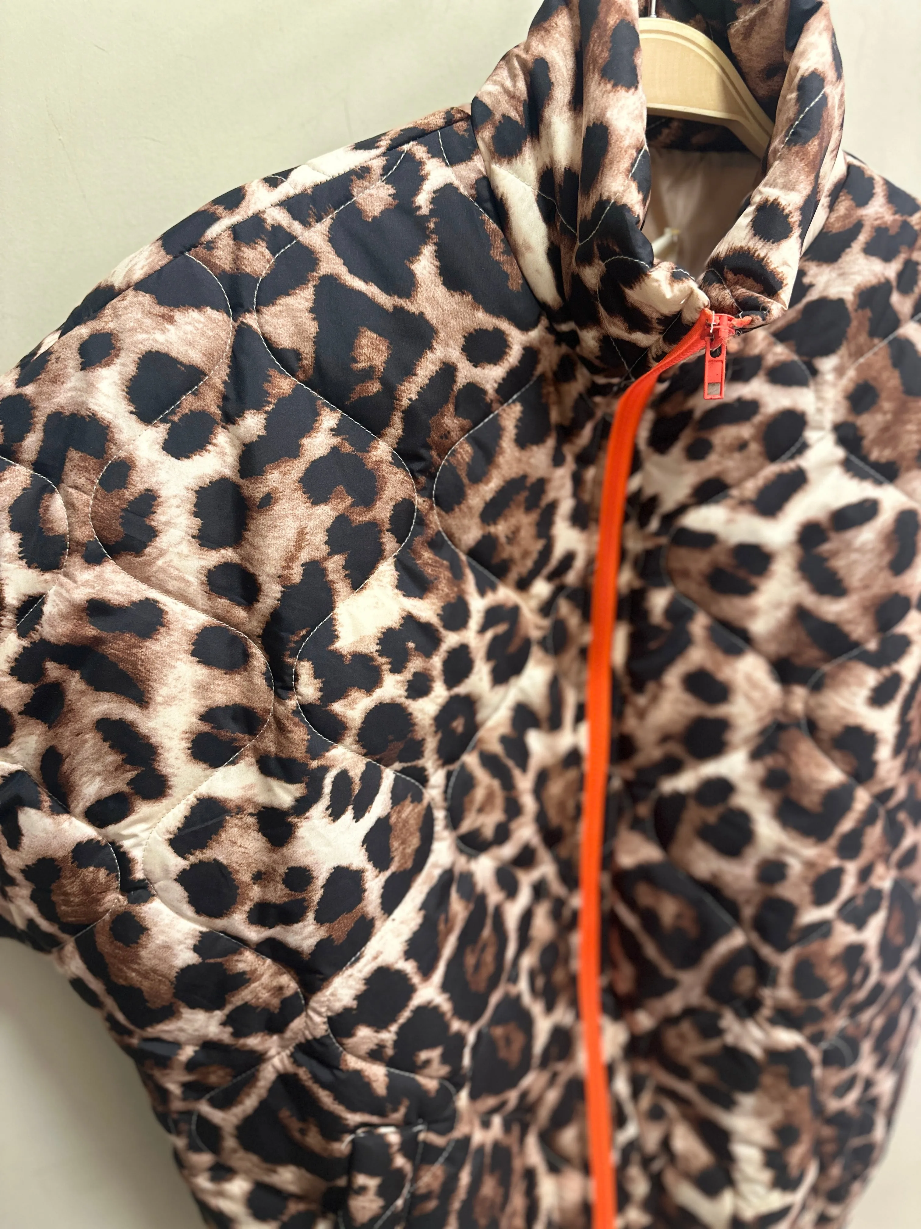 Padded showerproof leopard gilet with orange zip